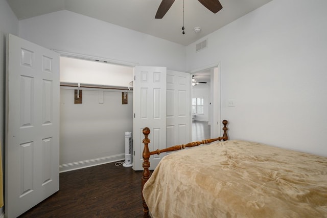 unfurnished bedroom with lofted ceiling, dark hardwood / wood-style floors, and ceiling fan