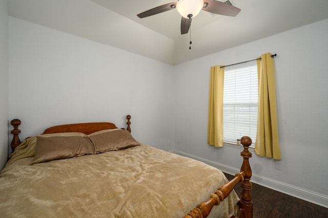 bedroom with ceiling fan and dark hardwood / wood-style flooring