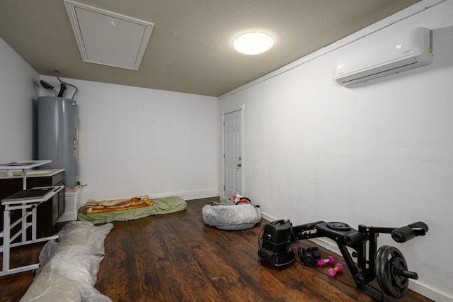 interior space with water heater, dark wood-type flooring, and an AC wall unit