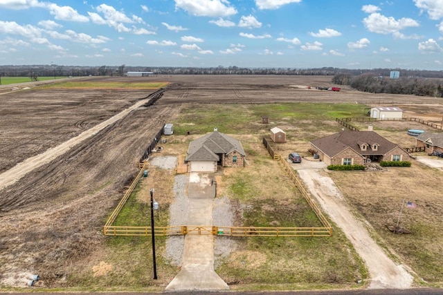 birds eye view of property with a rural view