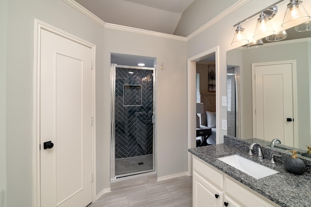 bathroom featuring crown molding, vanity, and a shower with shower door