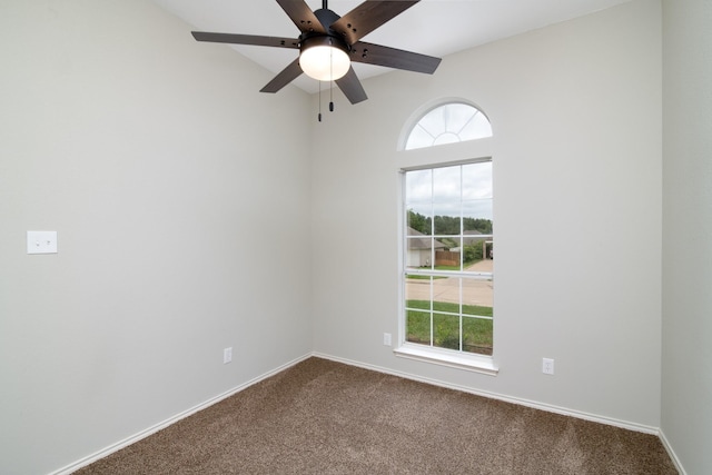 unfurnished room featuring ceiling fan and carpet floors