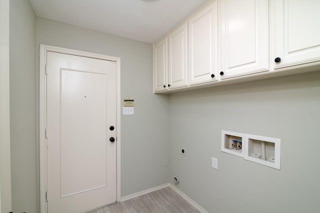 laundry room featuring cabinets, light hardwood / wood-style floors, hookup for a washing machine, and electric dryer hookup