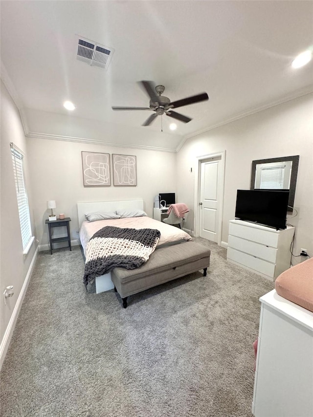 bedroom featuring ornamental molding, carpet flooring, and ceiling fan