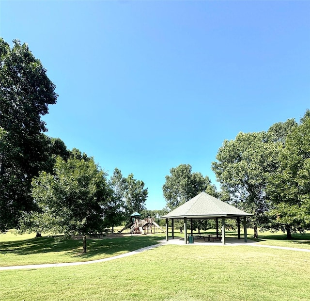 view of community featuring a yard, a gazebo, and a playground