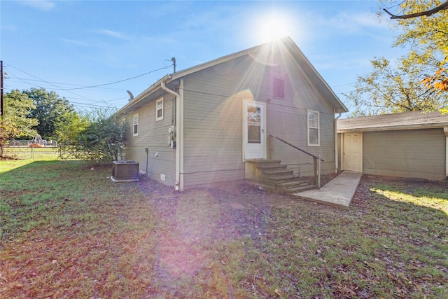 exterior space with a front yard and central air condition unit