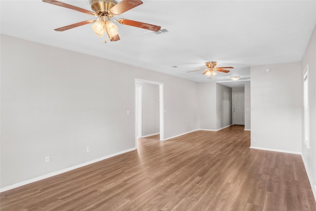 unfurnished room with hardwood / wood-style flooring and ceiling fan