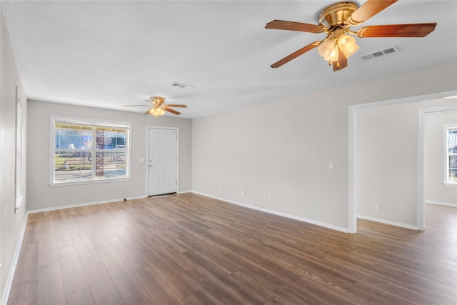 empty room featuring hardwood / wood-style flooring and ceiling fan