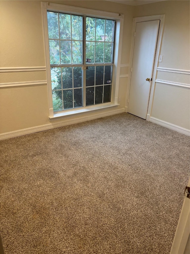 unfurnished room with carpet floors