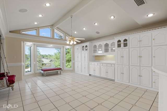 kitchen featuring white cabinetry, lofted ceiling with beams, and ceiling fan