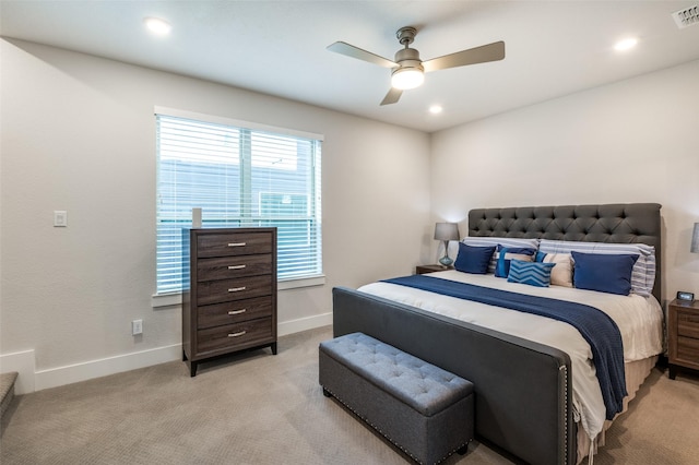 bedroom featuring ceiling fan and light carpet