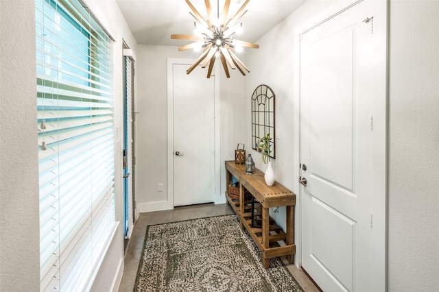 entryway featuring a chandelier