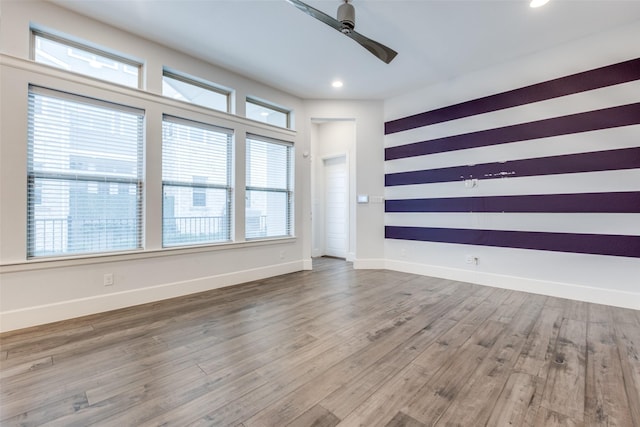 unfurnished room featuring hardwood / wood-style flooring and ceiling fan