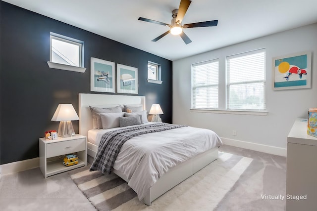 carpeted bedroom with ceiling fan