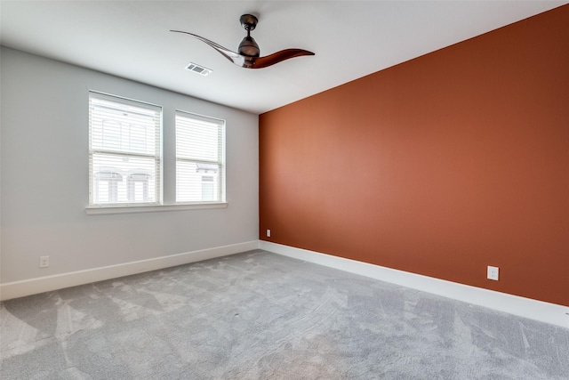 carpeted empty room with ceiling fan