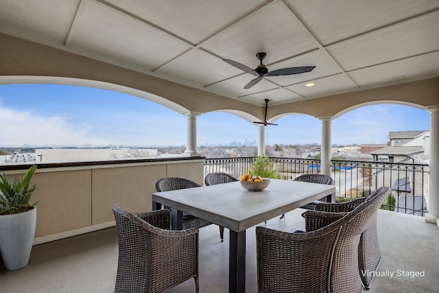 view of patio / terrace with ceiling fan and a balcony