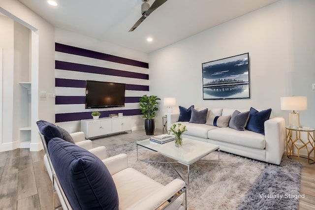 living room with ceiling fan and hardwood / wood-style floors