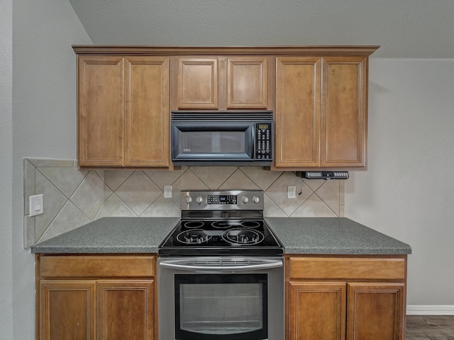 kitchen featuring tasteful backsplash and electric stove