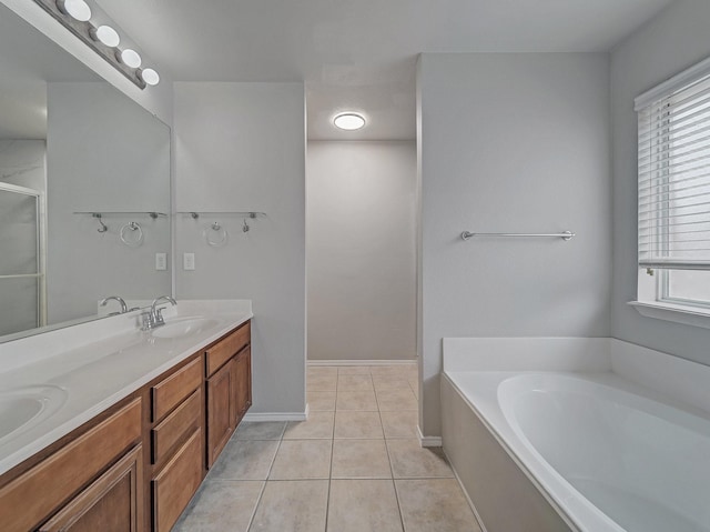 bathroom with tile patterned flooring, vanity, and separate shower and tub