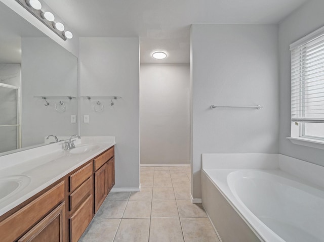 bathroom featuring vanity, shower with separate bathtub, and tile patterned floors