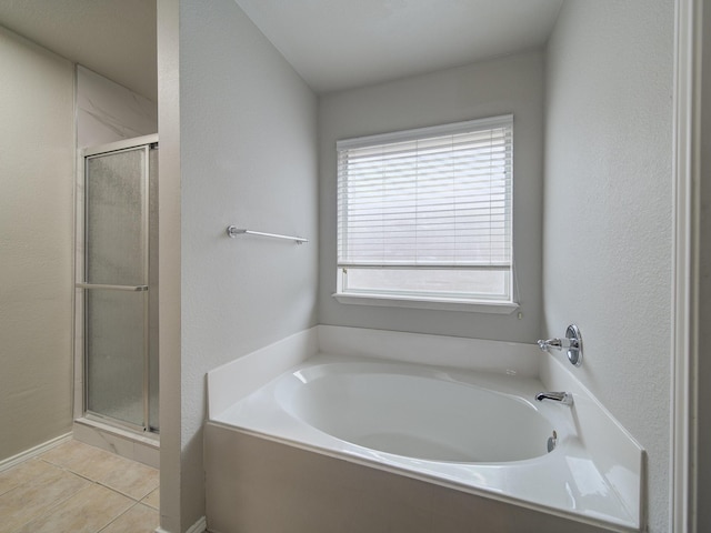 bathroom with tile patterned floors and plus walk in shower