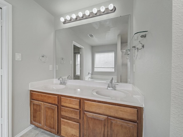 821 Grace Ln, Saginaw, TX 76179 - bathroom featuring a bath, double vanity, a shower with door, and tile patterned flooring