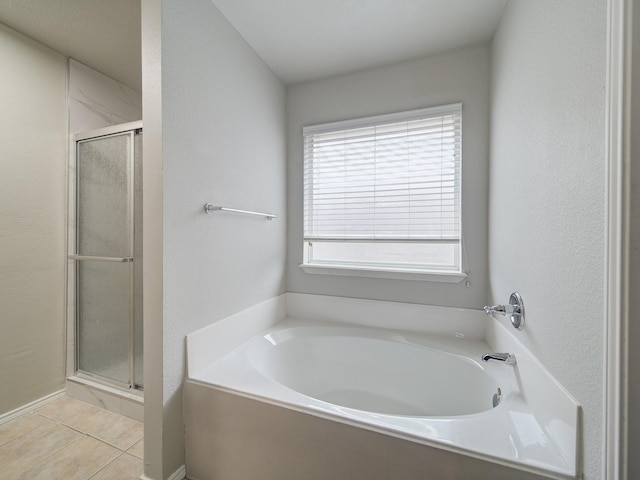 821 Grace Ln, Saginaw, TX 76179 - bathroom with a shower stall, tile patterned floors, and a garden tub