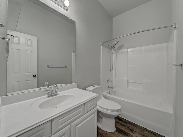 full bathroom featuring bathtub / shower combination, vanity, toilet, and hardwood / wood-style floors