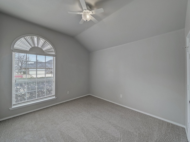 additional living space featuring carpet floors, vaulted ceiling, and ceiling fan