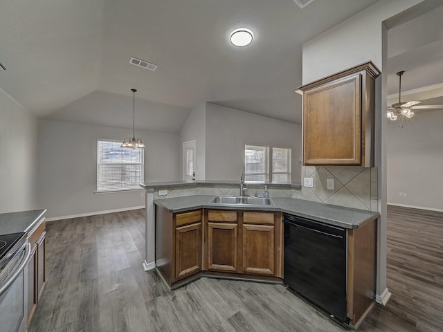 kitchen with black dishwasher, sink, stainless steel range with electric cooktop, backsplash, and plenty of natural light