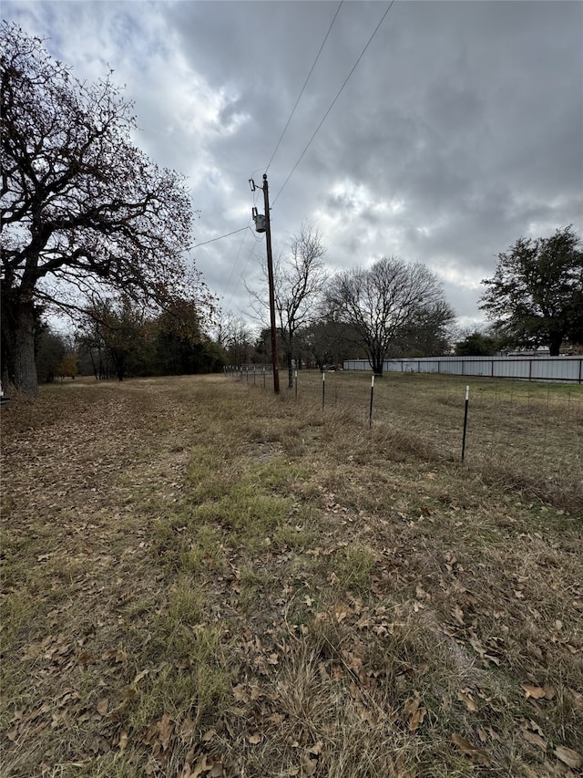 view of yard with a rural view