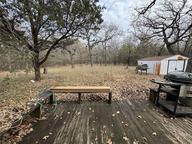 wooden deck featuring a storage shed