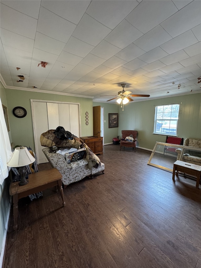 bedroom featuring hardwood / wood-style floors, crown molding, and ceiling fan