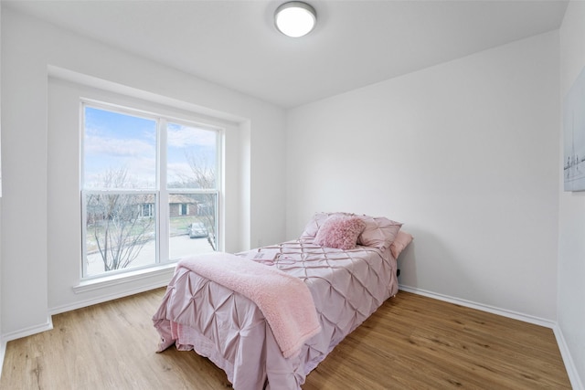 bedroom with light hardwood / wood-style flooring