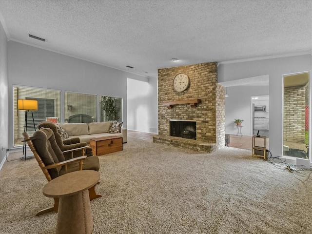 carpeted living room with crown molding, a brick fireplace, and a textured ceiling