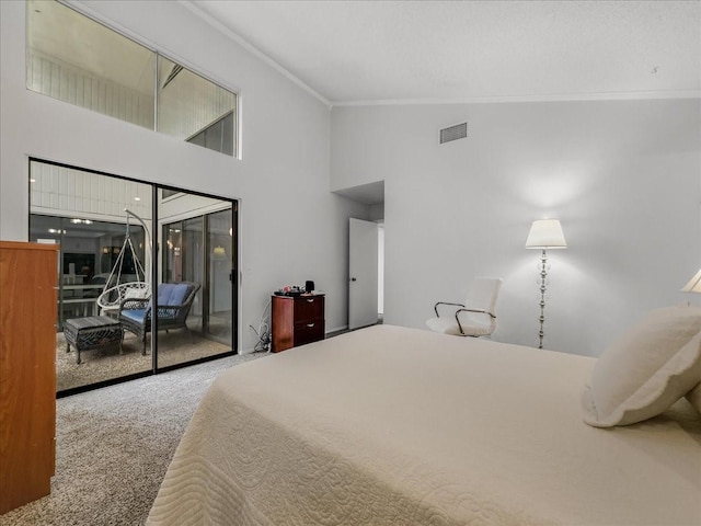 carpeted bedroom with ornamental molding, a towering ceiling, and access to exterior