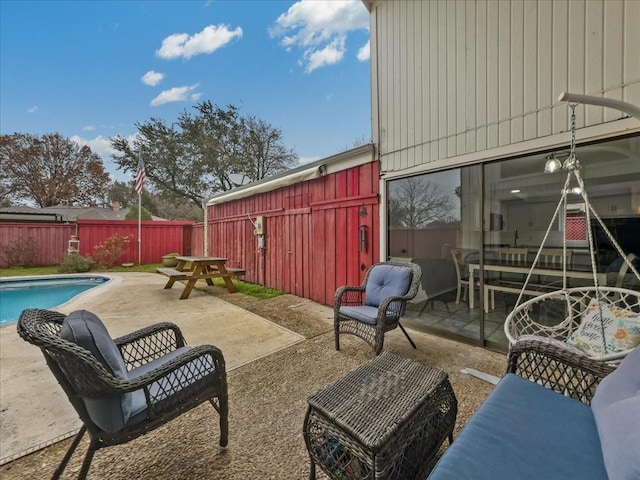 view of patio with a fenced in pool