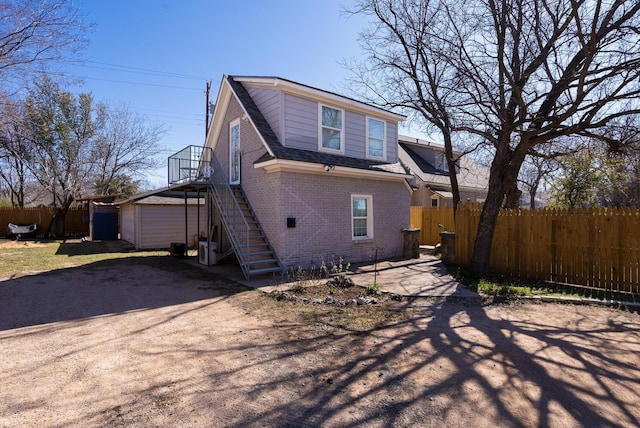 exterior space featuring an outbuilding and a garage