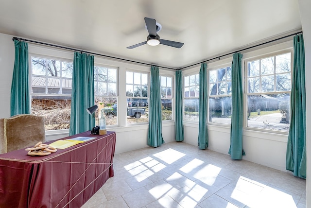 sunroom / solarium with ceiling fan