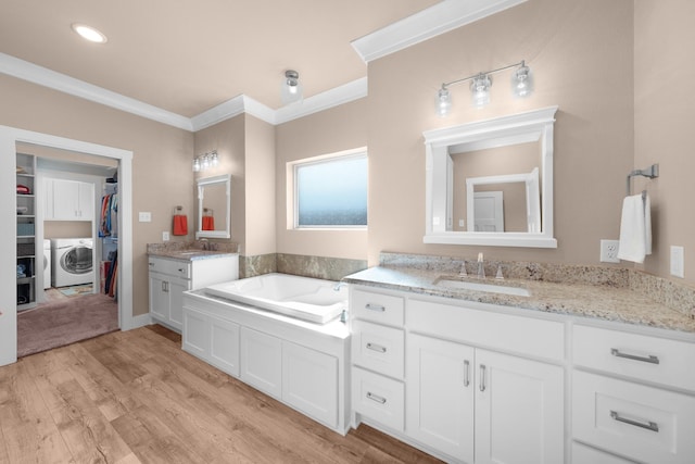 bathroom featuring vanity, crown molding, and hardwood / wood-style flooring