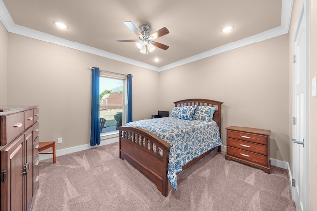 carpeted bedroom featuring ornamental molding and ceiling fan