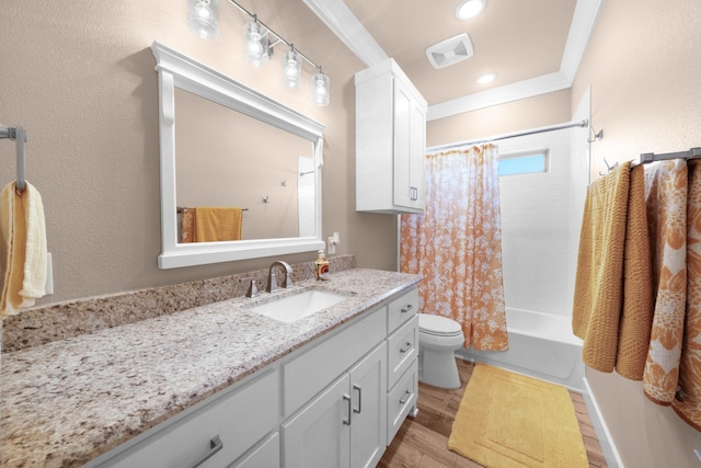 full bathroom featuring shower / tub combo with curtain, vanity, wood-type flooring, ornamental molding, and toilet