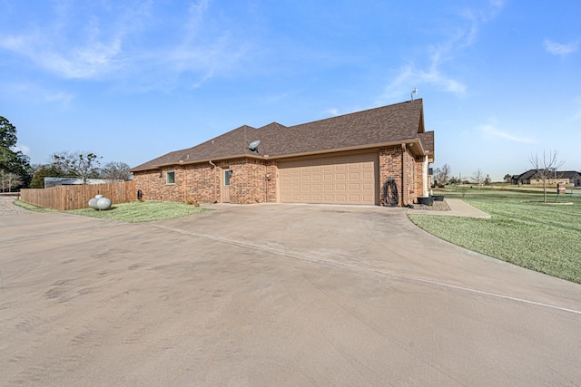 view of front of home with a garage and a front yard