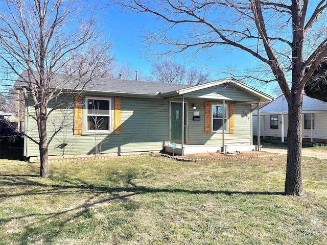 view of front of property with a porch and a front lawn