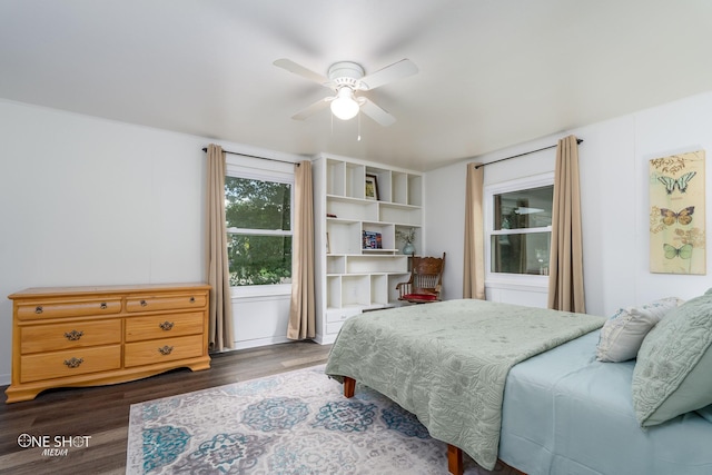 bedroom with dark wood-type flooring and ceiling fan