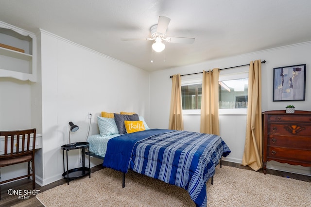 bedroom featuring crown molding, light hardwood / wood-style flooring, and ceiling fan