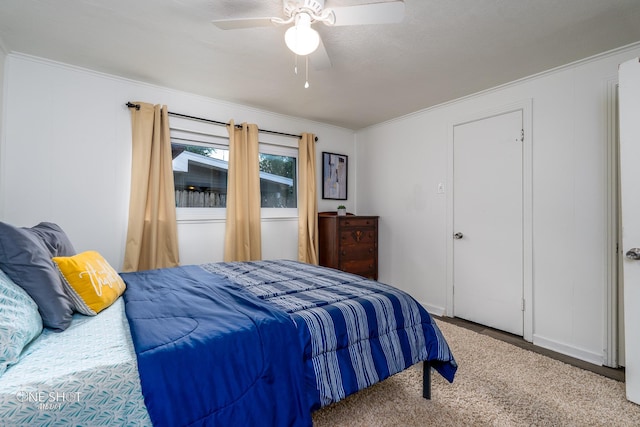 bedroom with ornamental molding and ceiling fan