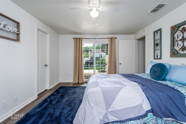 bedroom with ceiling fan and dark hardwood / wood-style flooring