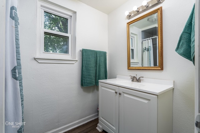 bathroom with vanity and hardwood / wood-style floors