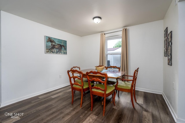 dining area featuring dark hardwood / wood-style floors